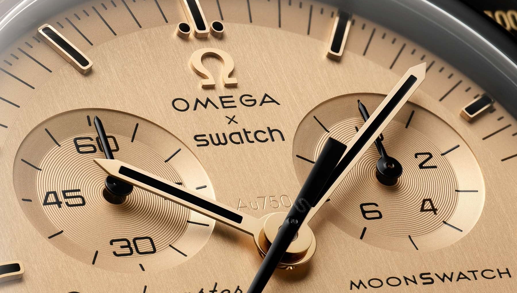 MoonSwatch Mission to the Moon 1969 Moonshine Gold kadran ve Au750 damgası