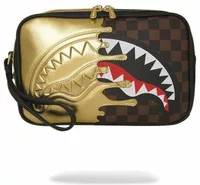 Sprayground Sharks In Paris Gold Drip Toiletry Brick Gold